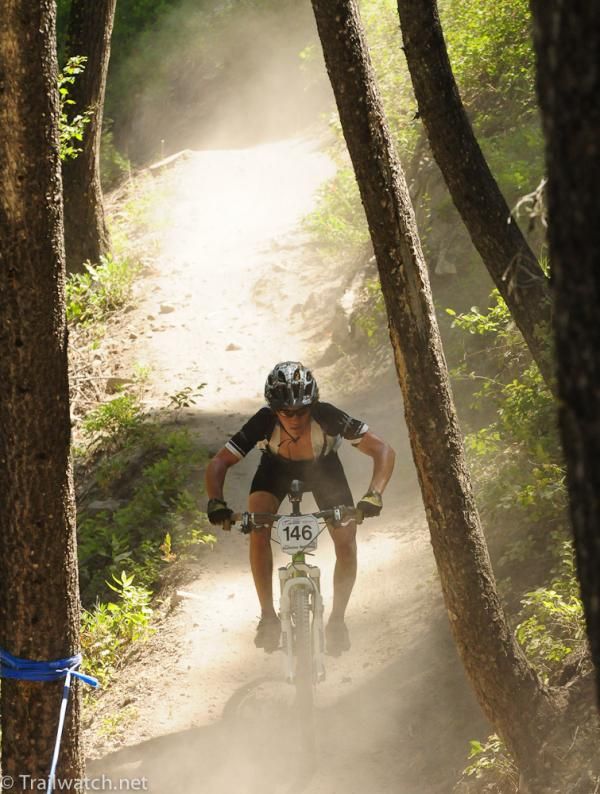 Isaac Stackonis riding through clouds of dust in the 17-18 race
