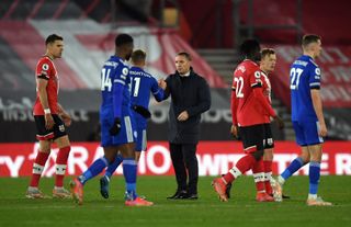 Brendan Rodgers (centre) after the match