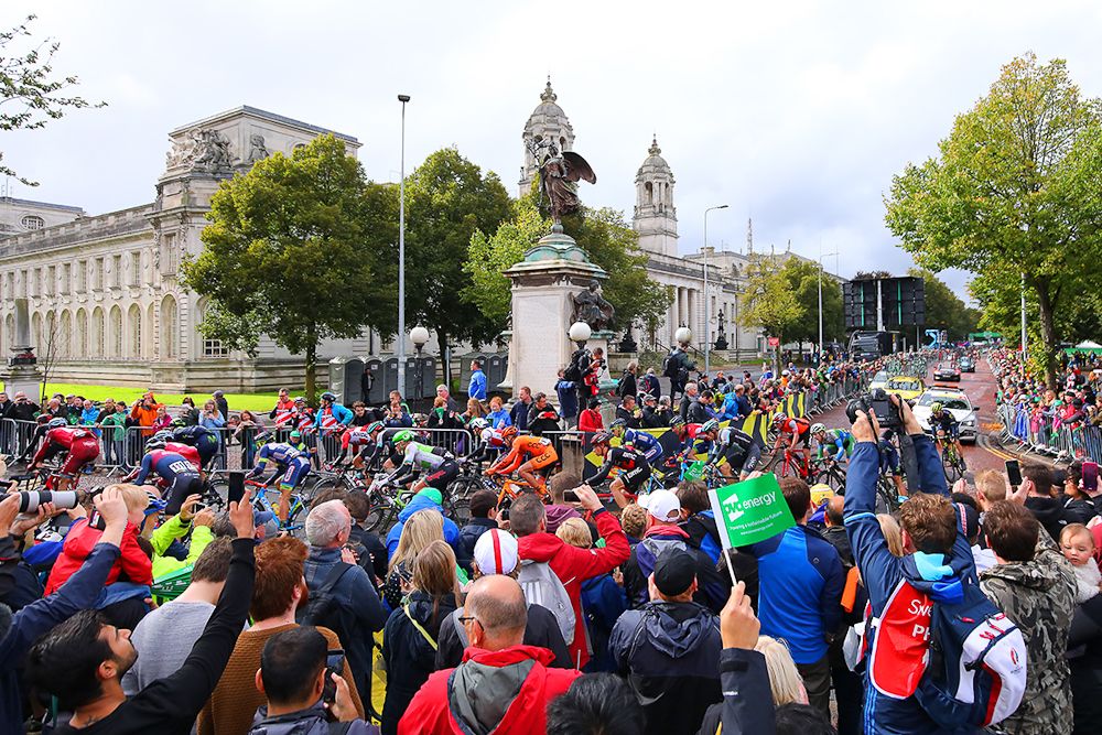 The peloton rolls by big crowds in Cardiff during stage 8 at the Tour of Britain