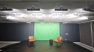 The new podcast studio lit up at Associa.