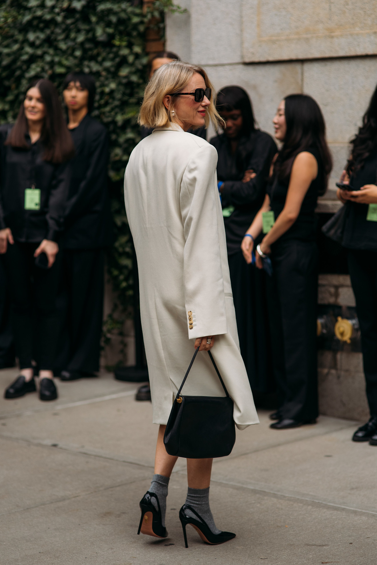 Woman wearing a skirt with socks and heels