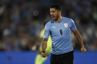 Luis Suarez celebrates after scoring for Uruguay against Venezuela in February 2022.