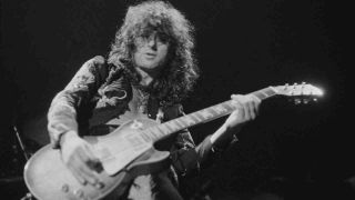 Jimmy Page playing guitar onstage in the 1970s
