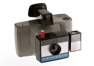 Polaroid instant picture cameras filled a niche market in 1960s photography. With the introduction of Polaroid's instant colour pictures in 1962, the photographer no longer had to send pictures off to a laboratory for processing; he just pulled a tab at the end of the film, waited 50 seconds then peeled off the backing to reveal the full-coloured picture. In tune with the vibrant 'swinging '60s�, Polaroid called their new instant colour camera the Swinger. (Photo by SSPL/Getty Images)