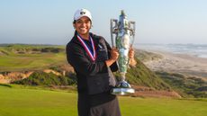 Megha Ganne holding the US Women's Amateur trophy 