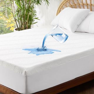 Bedsure Twin XL Mattress Protector on a bed.