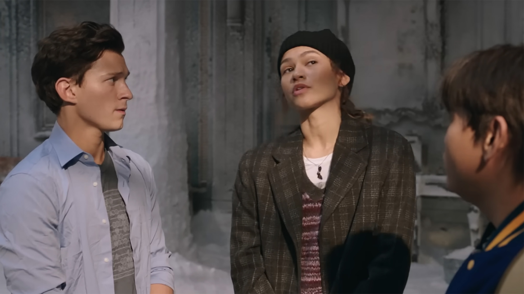 Peter, MJ and Ned staring at one another as they discuss with Dr. Strange In Spider-Man: No Way Home