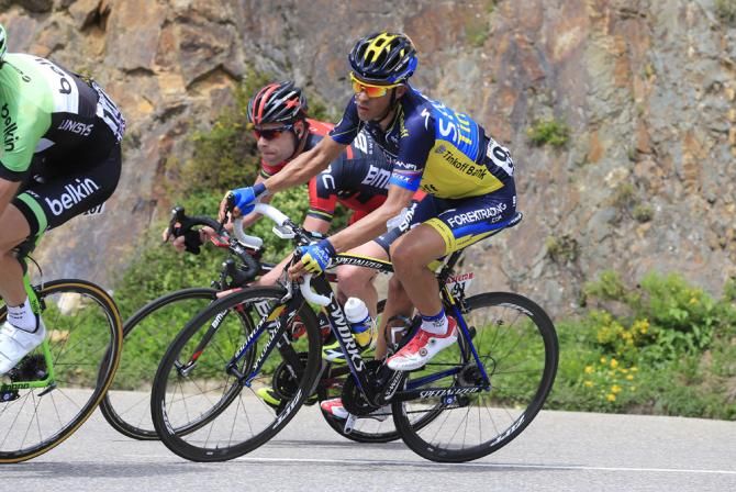 Previous Tour de France champions Alberto Contador (Saxo-Tinkoff) and Cadel Evans (BMC) ride alongside each other in stage 8