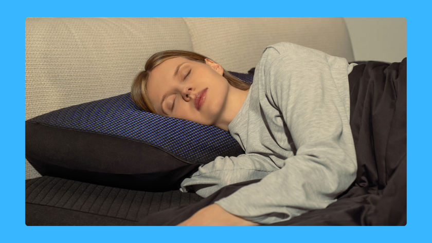 Woman sleeping on a pillow with the Eight Sleep Pod Pillow Cover on top