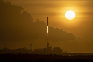 A SpaceX Falcon 9 rocket launches 60 Starlink internet satellites into space from Pad 39A of NASA's Kennedy Space Center in Cape Canaveral, Florida on Oct. 6, 2020. It was the third flight for the Falcon 9 booster.