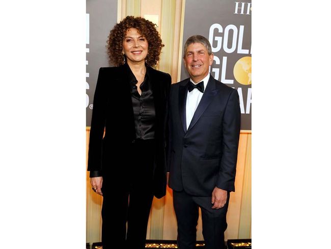Donna Langley (l.), chairman, Universal Filmed Entertainment Group; and Jeff Shell, CEO, NBCUniversal, arrive at the Beverly Hilton Hotel for the Golden Globe Awards.