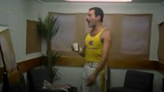 Freddie Mercury singing in a backstage portakabin