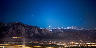Jupiter and Venus (right) setting behind the Flatiron Mountains near Boulder, Colorado, with the peaks of the Continental Divide in the distance. Skywatcher Patrick Cullis took this photo on March 9, 2012.