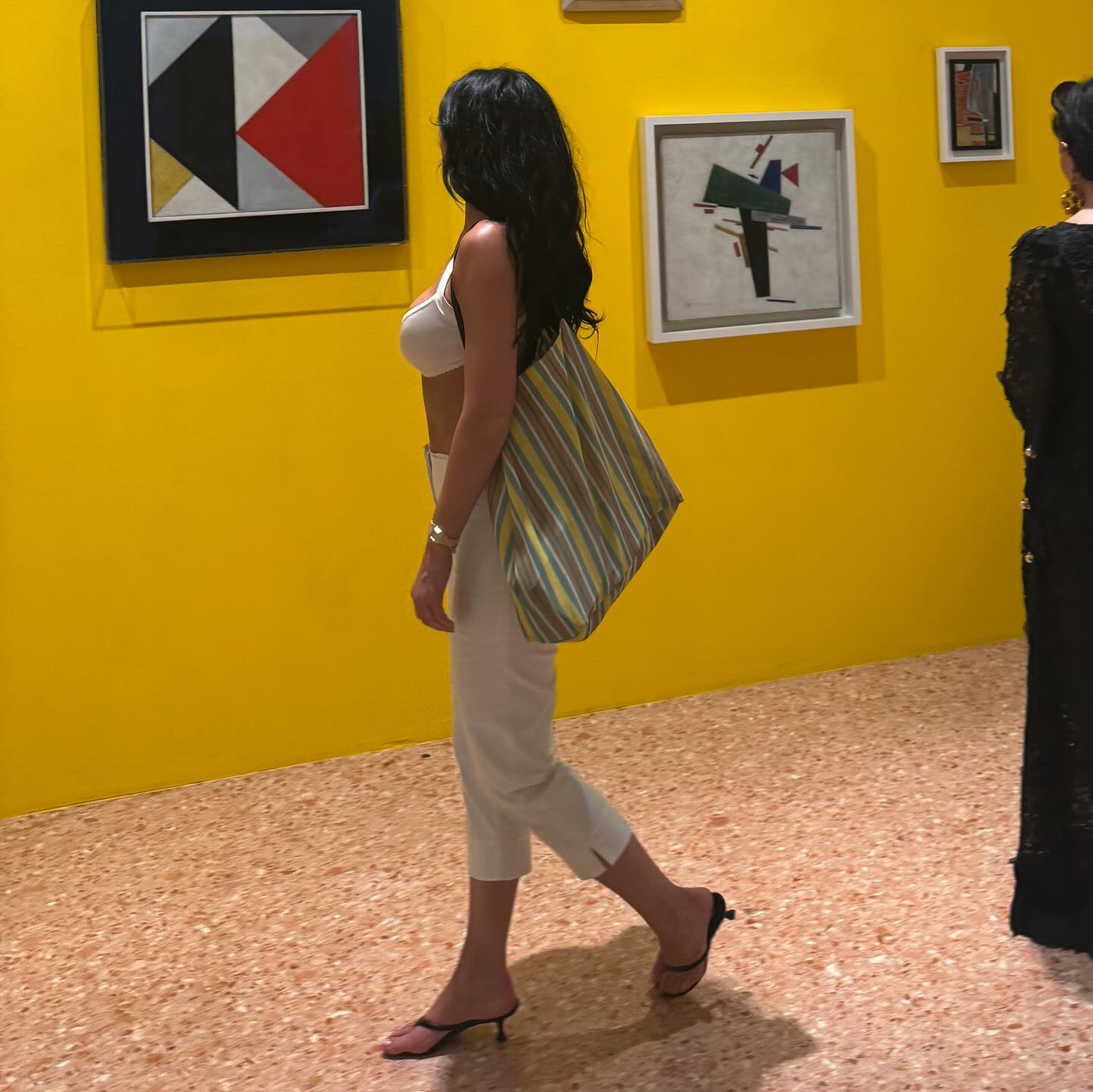 An image of @kyliejenner wearing The Row's barn mesh tote bag while at the Peggy Guggenheim Museum in Venice, Italy.