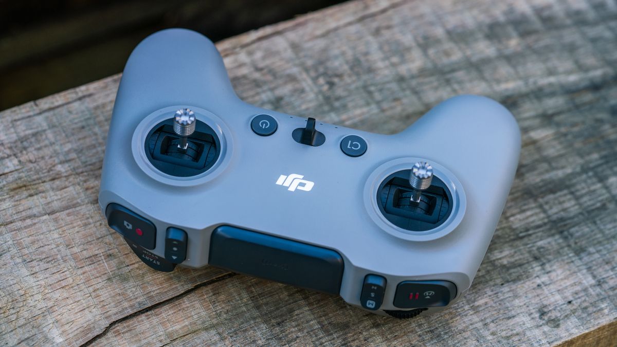 DJI Avata 2 FPV drone controller on a wooden bench