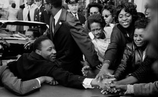Martin Luther King greeting people