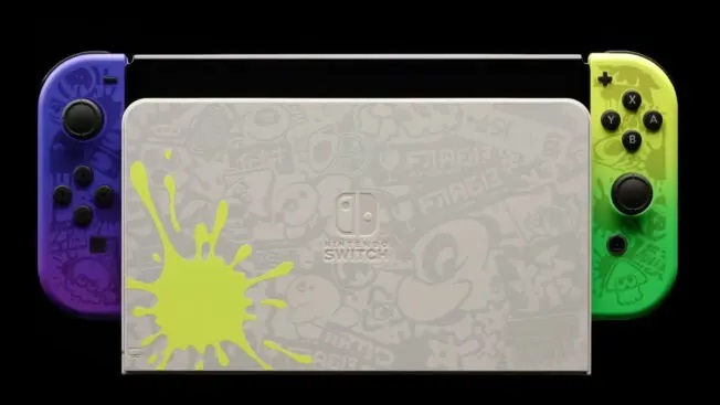 Splatoon 3 OLED in Neonfarben und comichaftem Lade-Deck