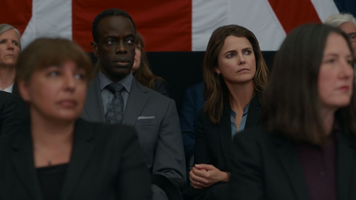 Stuart Heyford (Ato Essandoh) and Kate Wyler (Keri Russell) in a crowd in The Diplomat season one