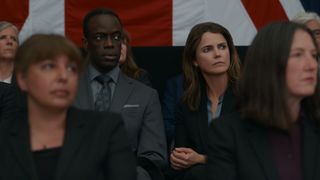 Stuart Heyford (Ato Essandoh) and Kate Wyler (Keri Russell) in a crowd in The Diplomat season one