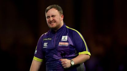 Luke Littler of England reacts during his semi-final match against Rob Cross of England on day 15 of the 2023/24 Paddy Power World Darts Championship