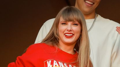 Taylor Swift spends New Years Eve watching the Kansas City Chiefs in support of her boyfriend Travis Kelce.