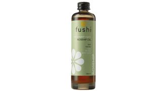 dark brown bottle of Fushi oil, with a green label as part of the baby massage oils round up