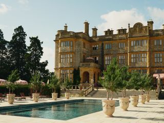 Swimming pool in front of a grand stone building