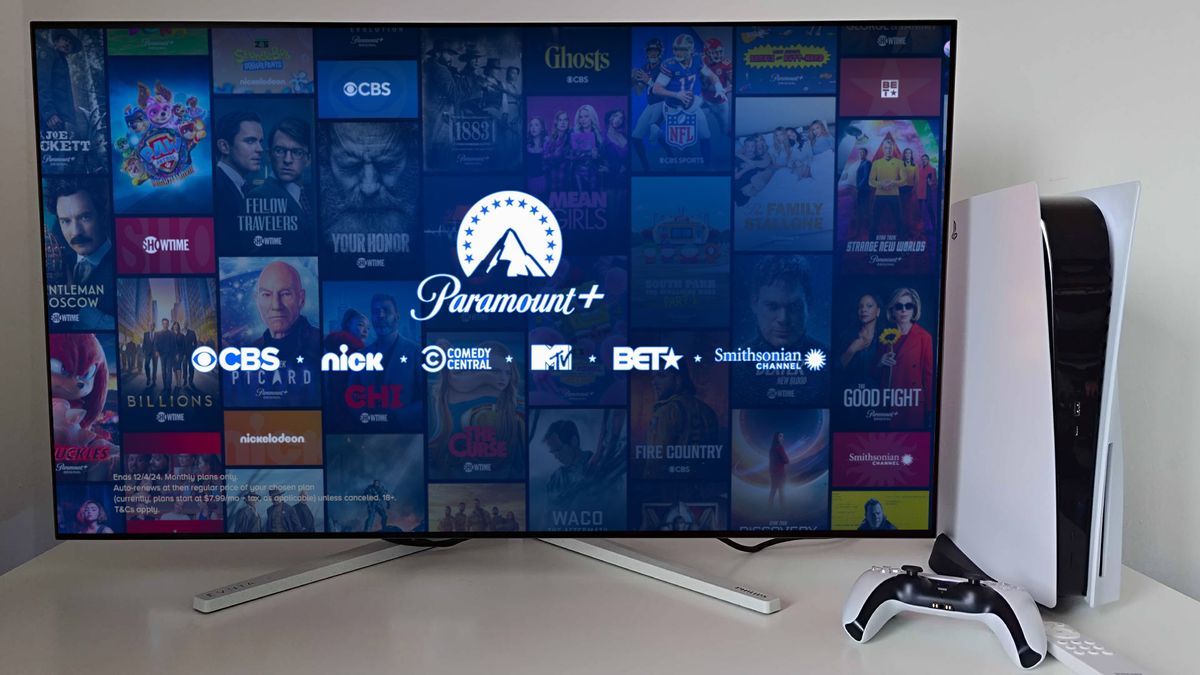 A TV displaying Paramount Plus on the screen beside a PS5