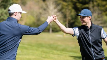 golfers doing a fist pump