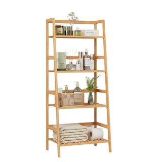 A four-tier wooden bamboo bookshelf with plants and baskets on it