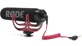 RØDE VideoMic GO accessory, pointing left with red coiled cable on a white background