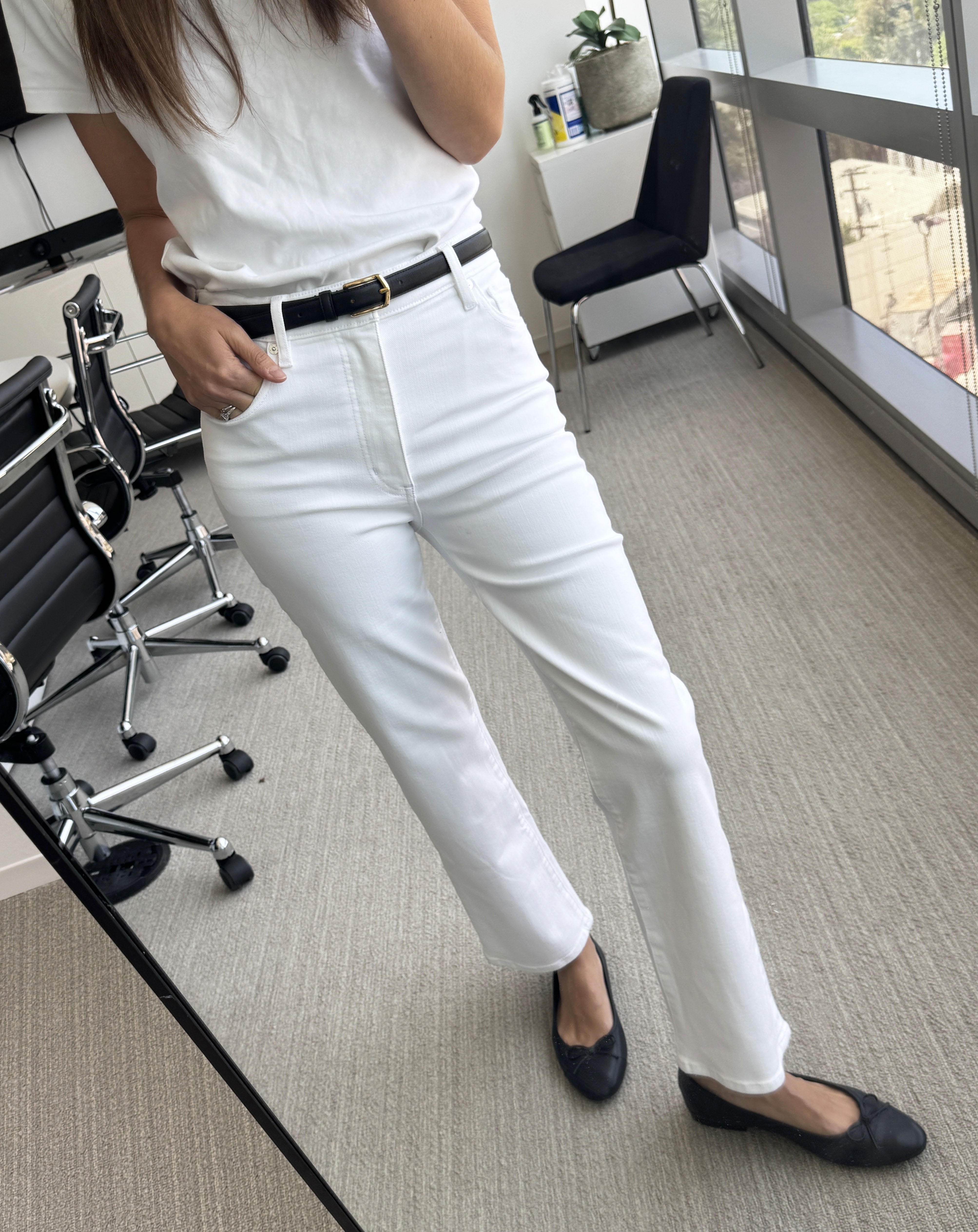 Woman in white Frame jeans