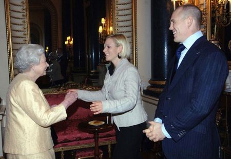 Family fun: Queen Elizabeth II with Zara and Mike Tindall at Buckingham Palace in 2006. (Photo by POOL/ Tim Graham Picture Library/Getty Images)