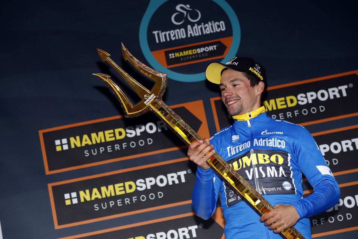 Primoz Roglic with the trident trophy