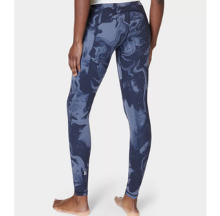 a model wearing the Sweaty Betty Super Soft Yoga Leggings in a marble print