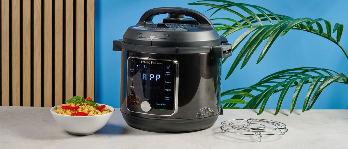 a black smart home enabled wi-Fi instant pot with a touchscreen and a 6QT inner pot is photographed against a blue background