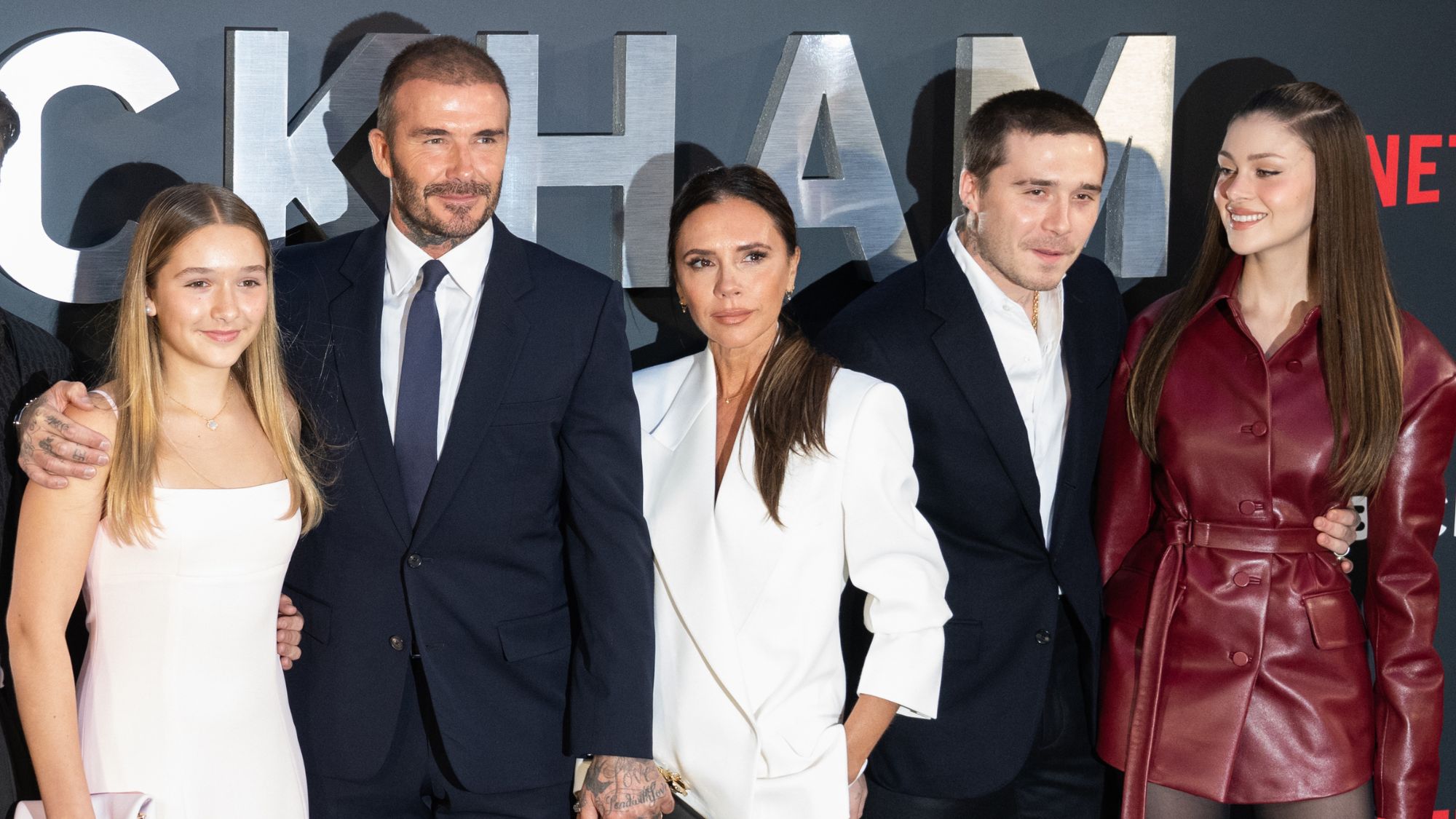 David, Victoria and Harper Beckham attend the premiere of 'Beckham' with Brooklyn and Nicola Peltz Beckham