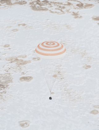 A NASA photographer took this photo of the Russian Soyuz TMA-16 spacecraft minutes from landing.