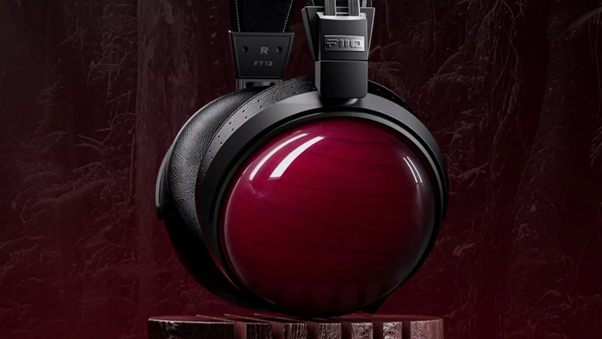Product shot of the FiiO FT13 against a very dark background