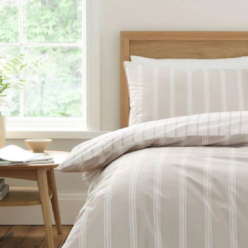 Beige and white pin striped bedding from Julian Charles.