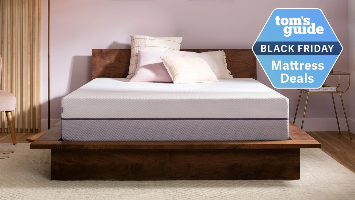 Purple mattress in a bedroom with a Tom&#039;s Guide Black Friday mattress sale label