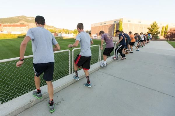 Each day starting with conditioning drills. Here the group practices ignition &ldquo;step ups&rdquo;.
