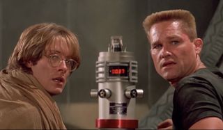 Stargate James Spader and Kurt Russell looking away from a ticking bomb