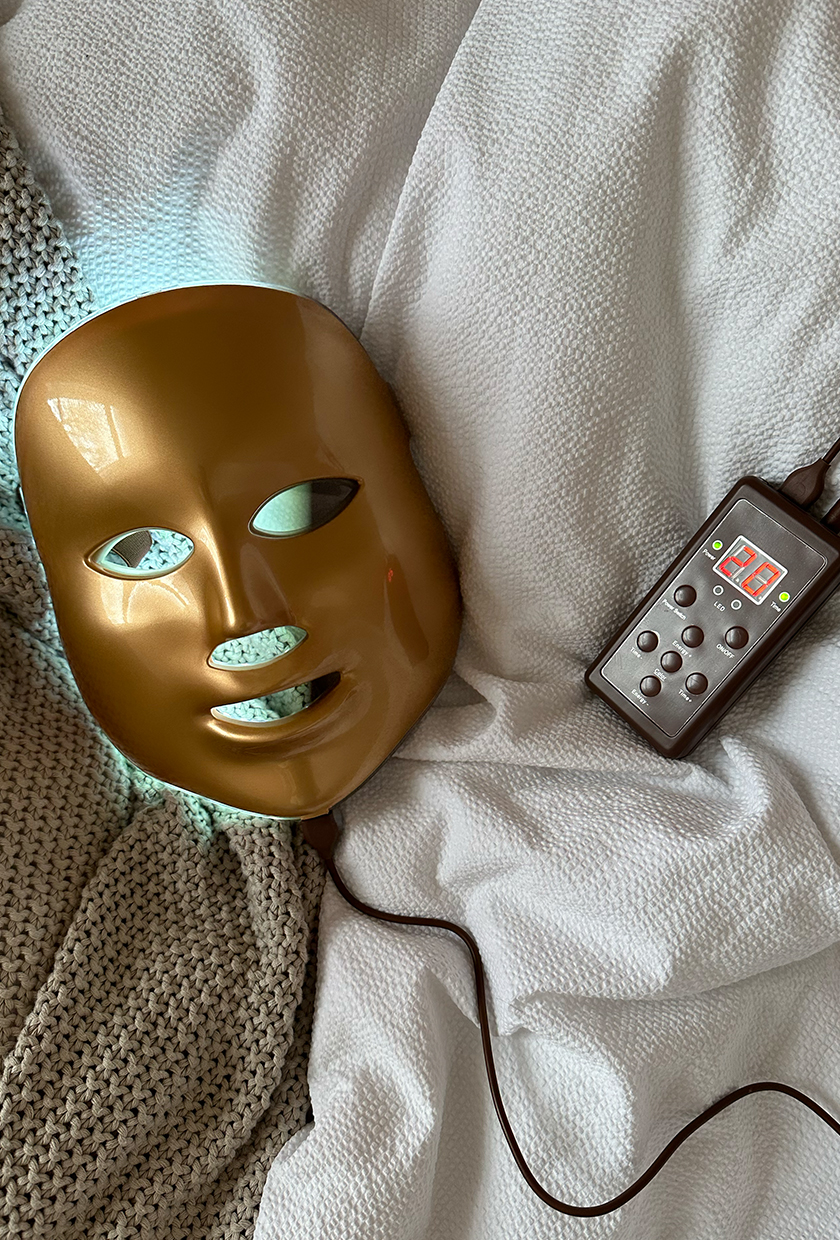 MZ LED Mask on blanket emitting blue light