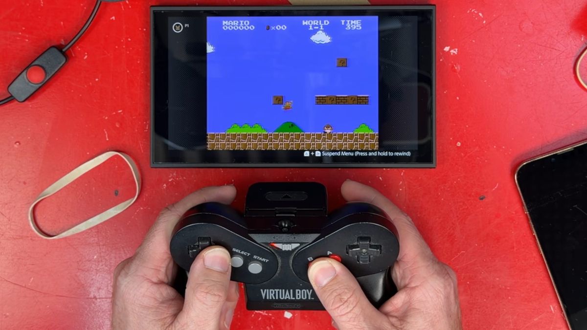 James Channel using modded Virtual Boy controller to play Super Mario Bros on Switch 2.