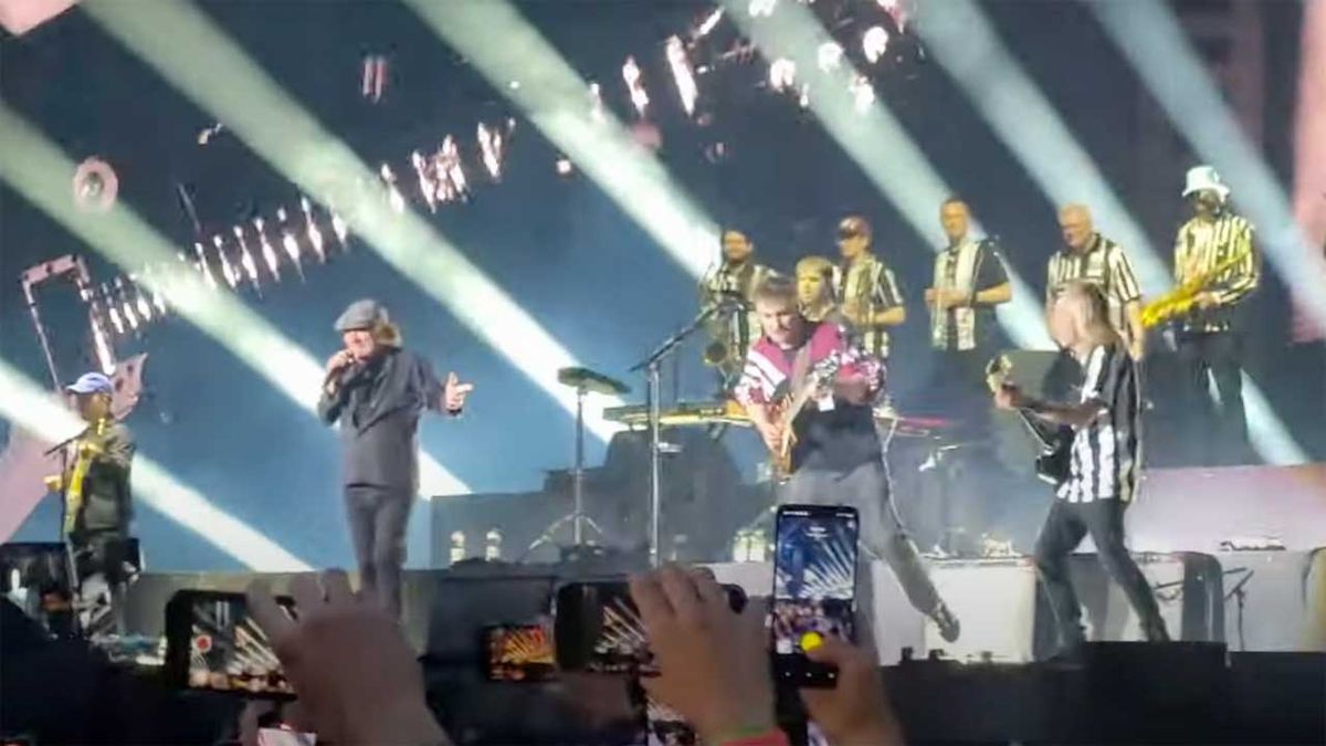 Brian Johnson onstage with Sam Fender