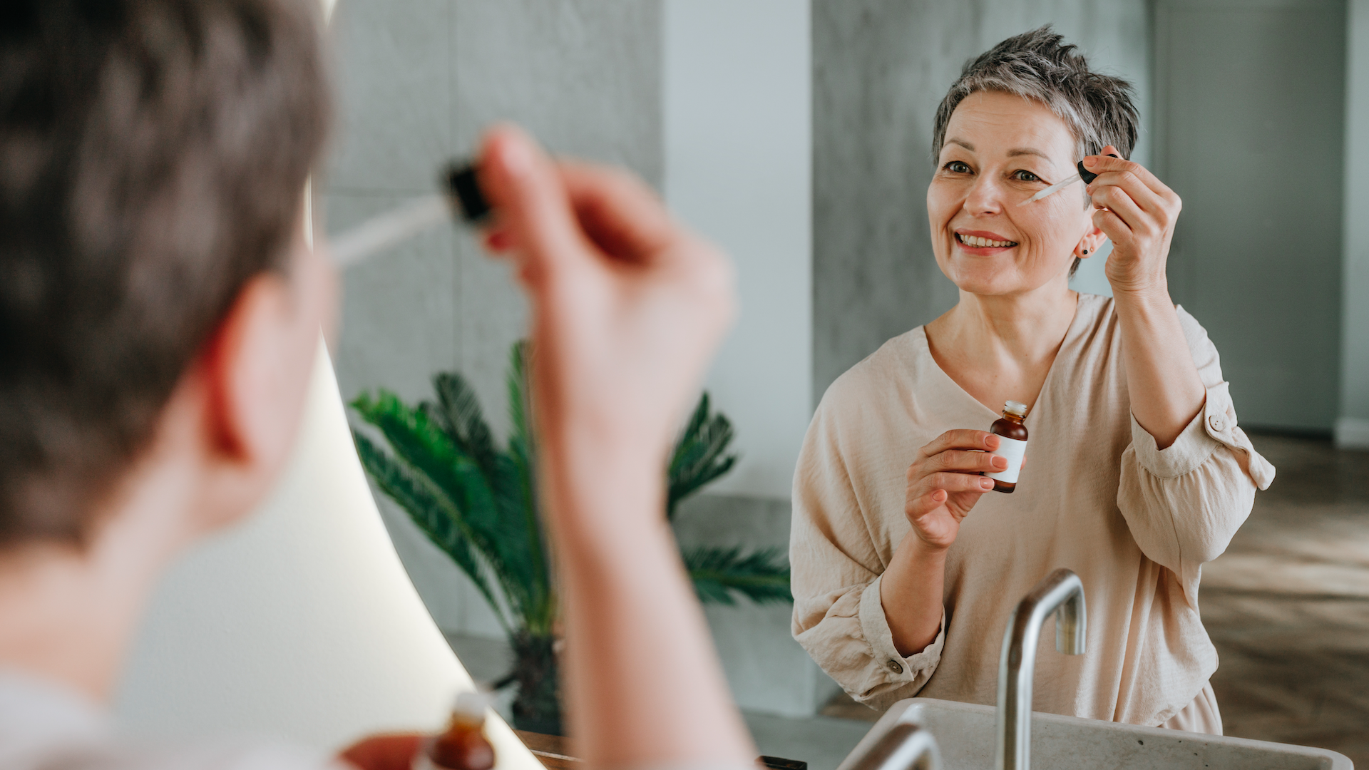 Woman using skincare product