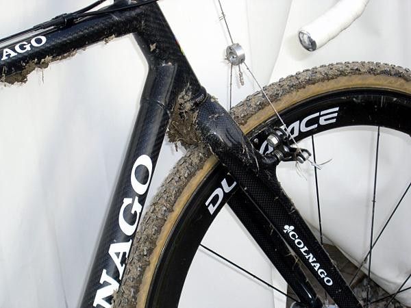 Boom's Colnago C50 'Cross carbon fiber fork and Shimano Dura-Ace carbon fibre wheels adorned with winning mud.