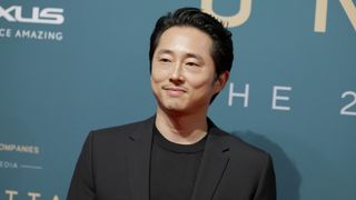 A press shot of Steven Yeun on the red carpet for the 21st Annual Unforgettable Gala