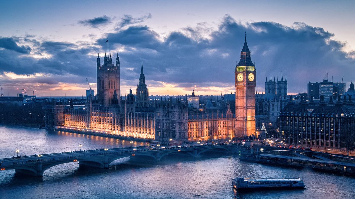 The Houses of Parliament photographed from across the River Thames with Westminster Bridge in the foreground